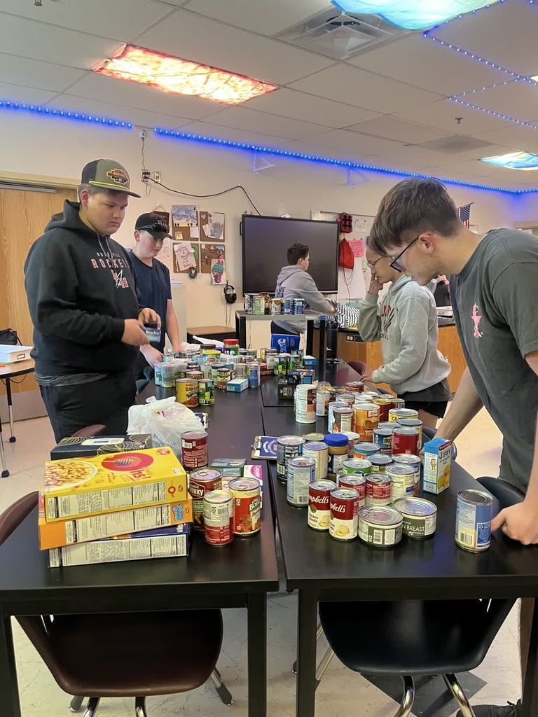 KAY Club Food Drive students packing up food