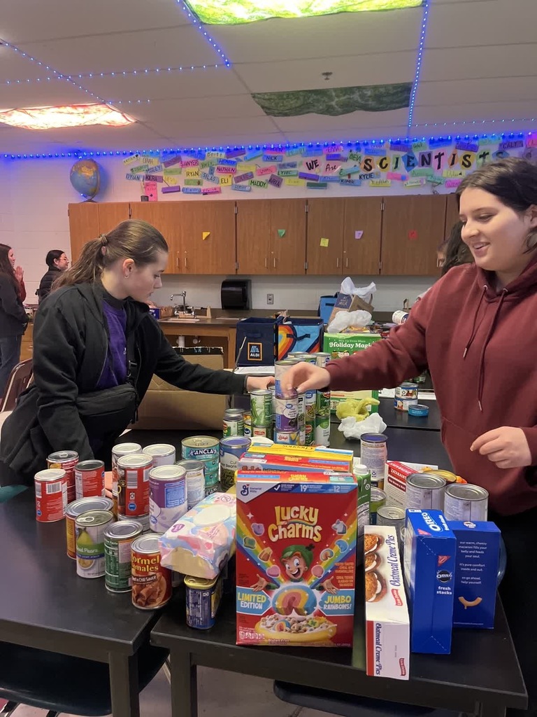 KAY Club Food Drive students packing up food