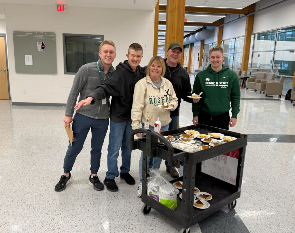 Roseau Students deliver thanksgiving pie to all staff members!