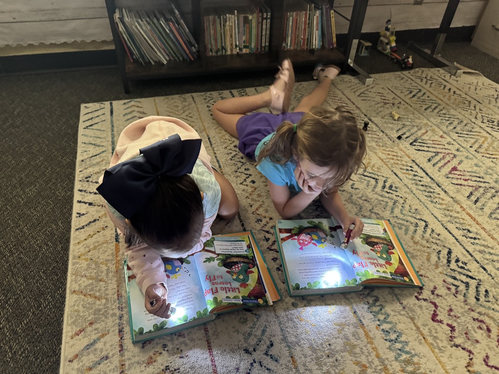 students reading with a flashlight