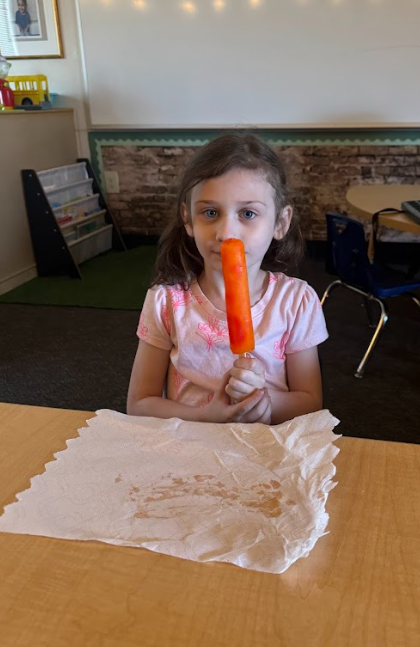 student with popsicle