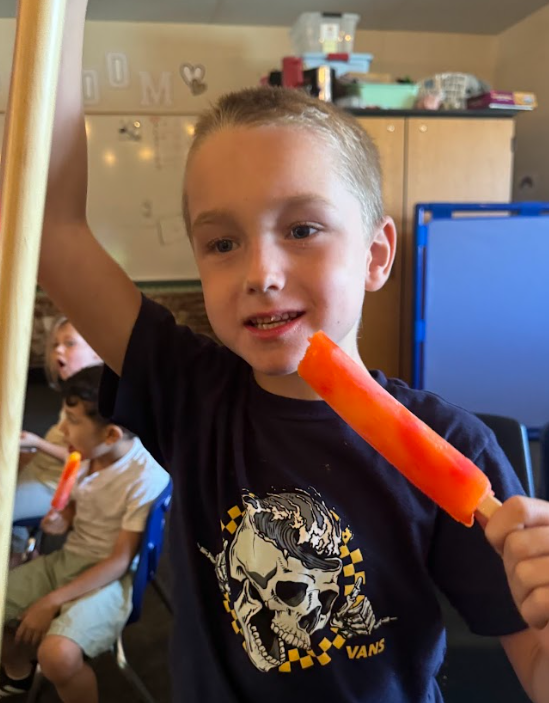 student with popsicle