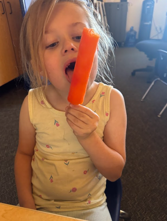 student with popsicle