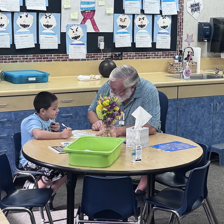 man working with a student 