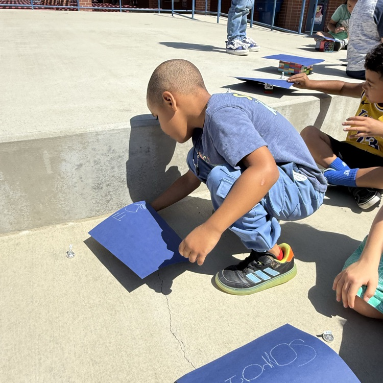 students creating a shade structure