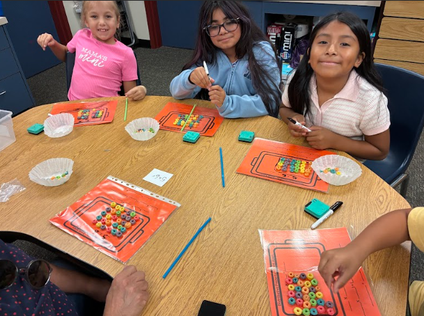 students with cereal doing math
