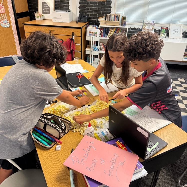 kids doing a class assignment with popcorn