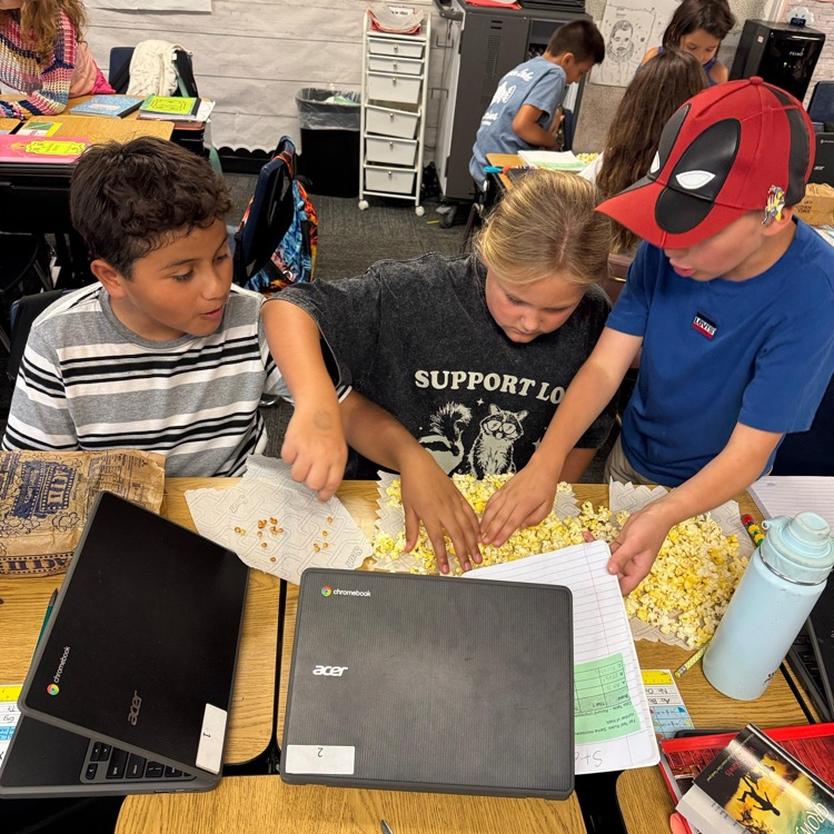 kids doing a class assignment with popcorn