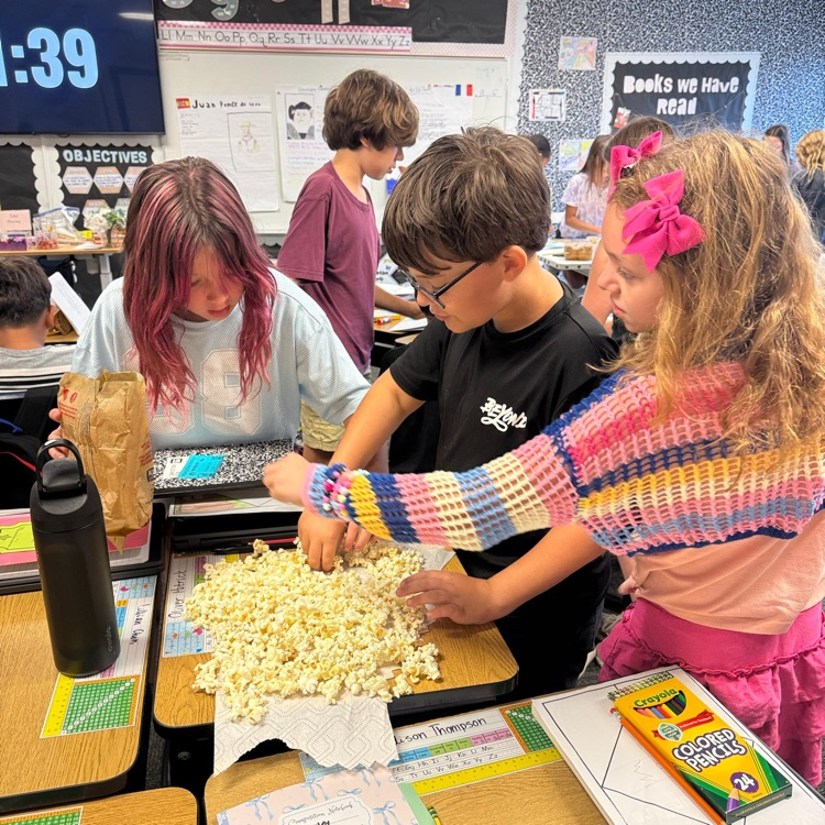 students working with popcorn