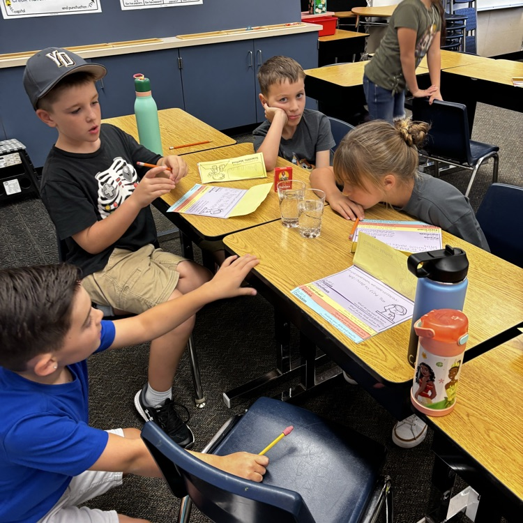kids doing an experiment with raisins and sprite