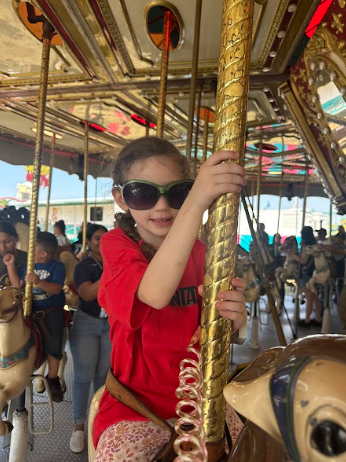 student on a Merry go round