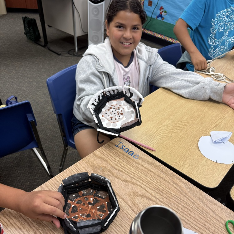 girl showing her created basket