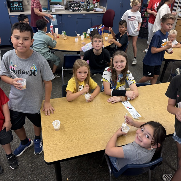 kids smiling and eating apple pie in a cup