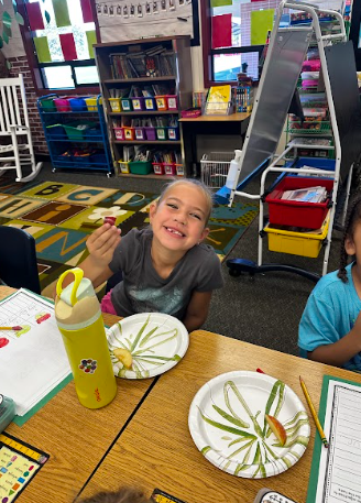 student tasting apple products