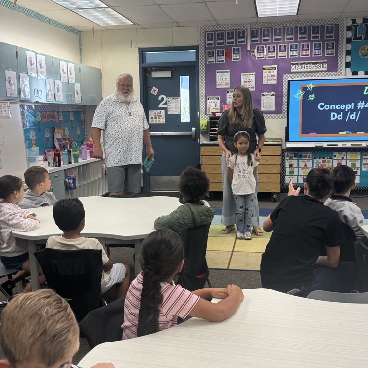 man and teacher speaking to students