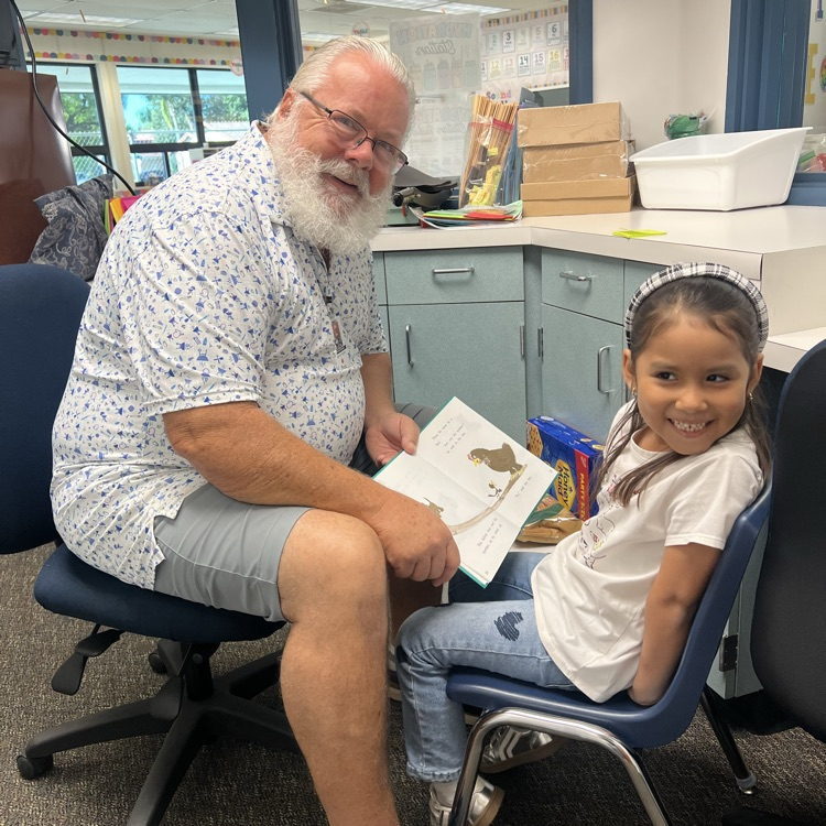 man reading to little girl