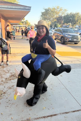 principal in an inflatable bull costume