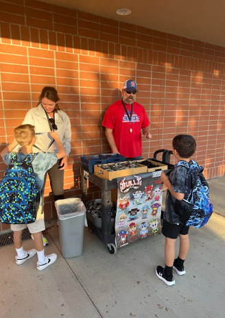 students collecting key chains