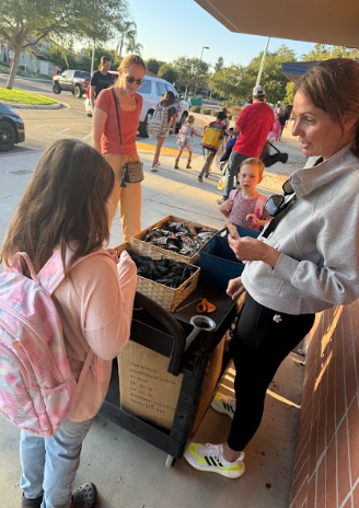students collecting key chains