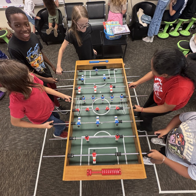 students playing foosball