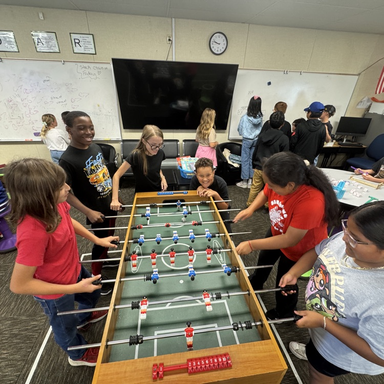 students playing foosball