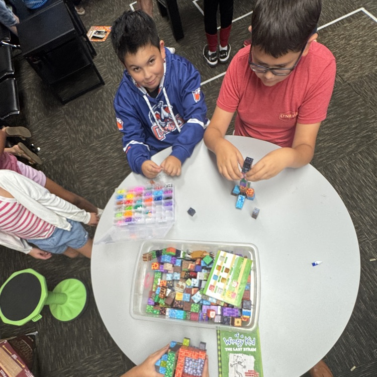 kids building with legos