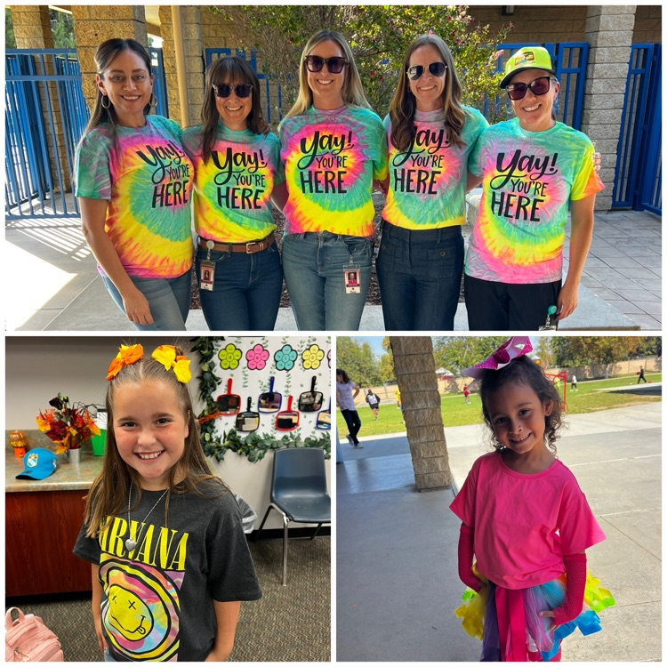 ladies wearing tie-dyed shirts and kids in neon colors