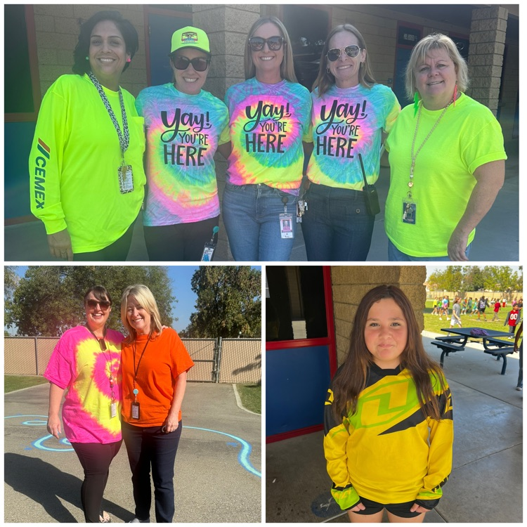 staff and students in tie-dyed and neon colored shirts 