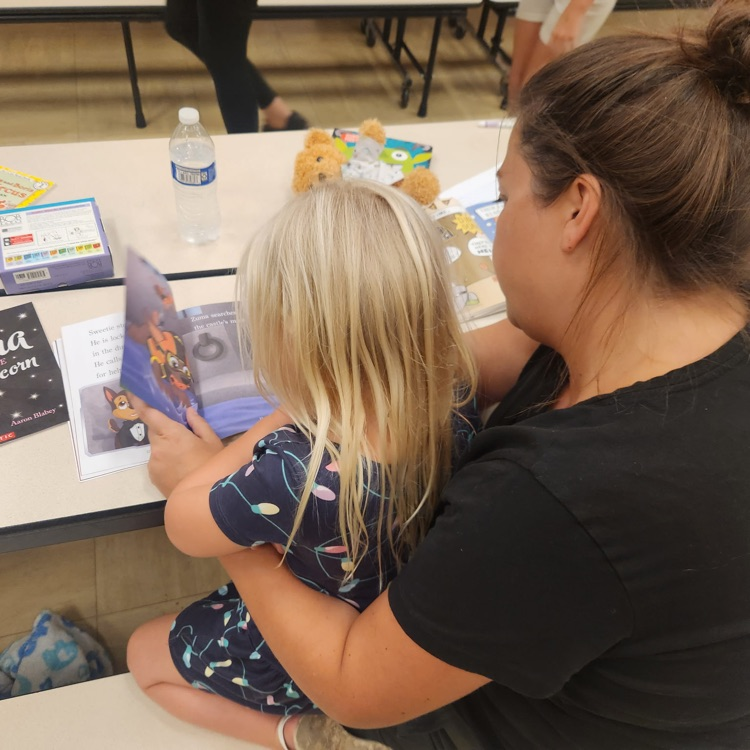 mom reading with her daughter