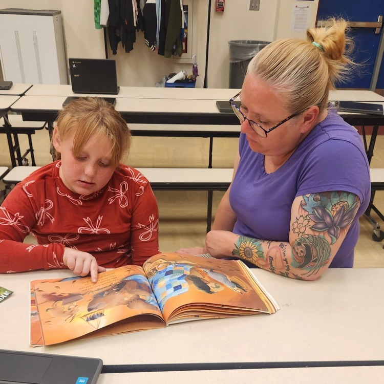 mom and daughter reading together 