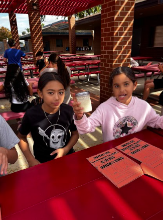 students making butter in a jar