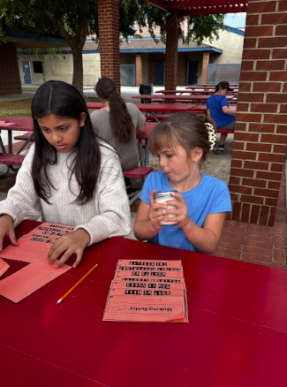 students making butter in a jar