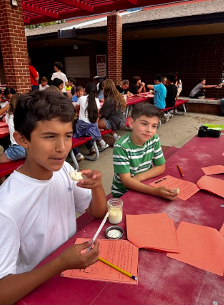 students making butter in a jar