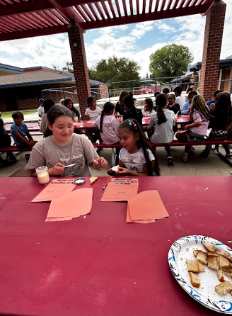 students making butter in a jar