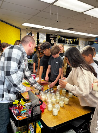 students filling jars up with milk