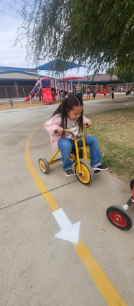 students playing on painted sidewalk