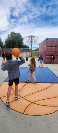 students playing on painted sidewalk