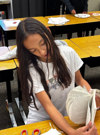 student with book pages
