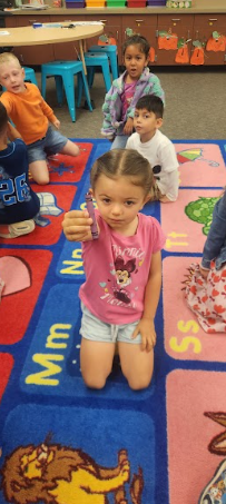 student with purple crayon