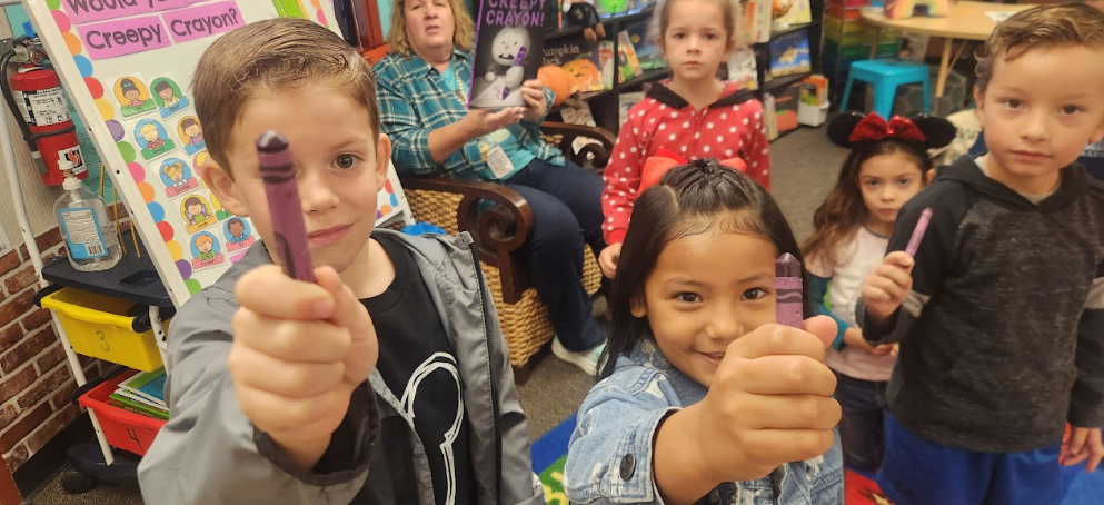 students with purple crayon