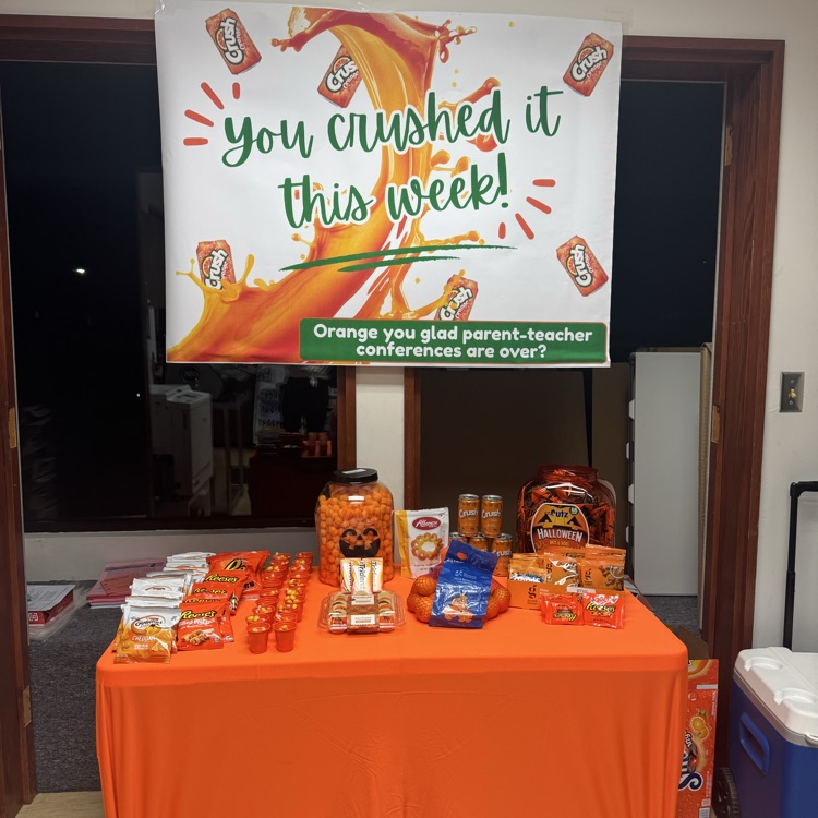 you crushed it this week sign above a table with orange snacks 
