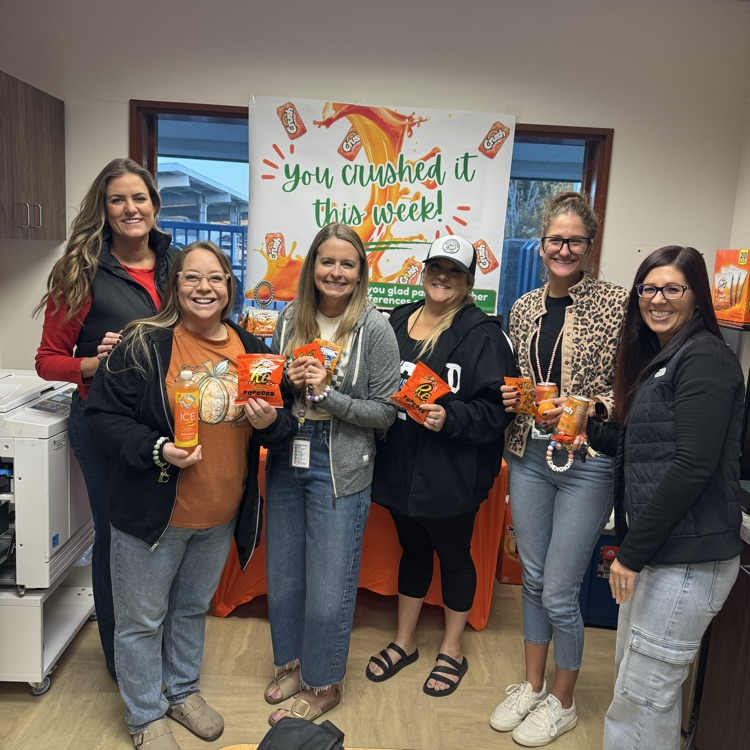groups of ladies smiling in front of sign “You crushed it this week"