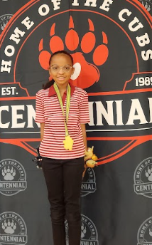 student with a medal