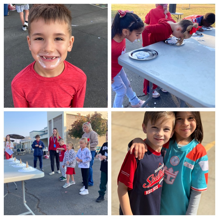 students smiling and eating off a plate
