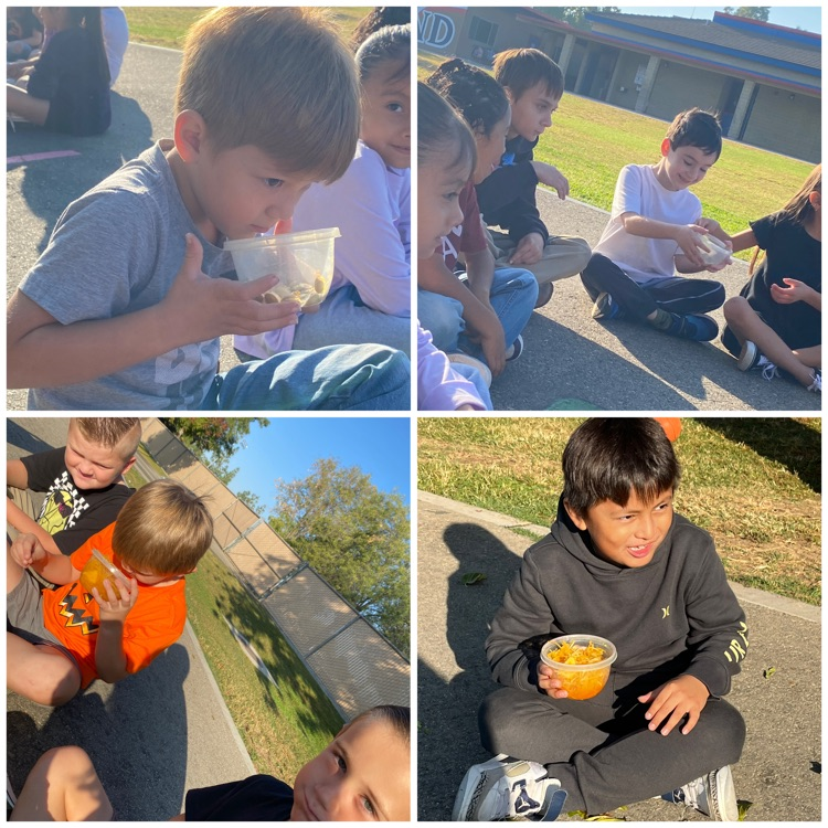 students with pumpkin in bowls