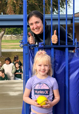 student by a dunk tank