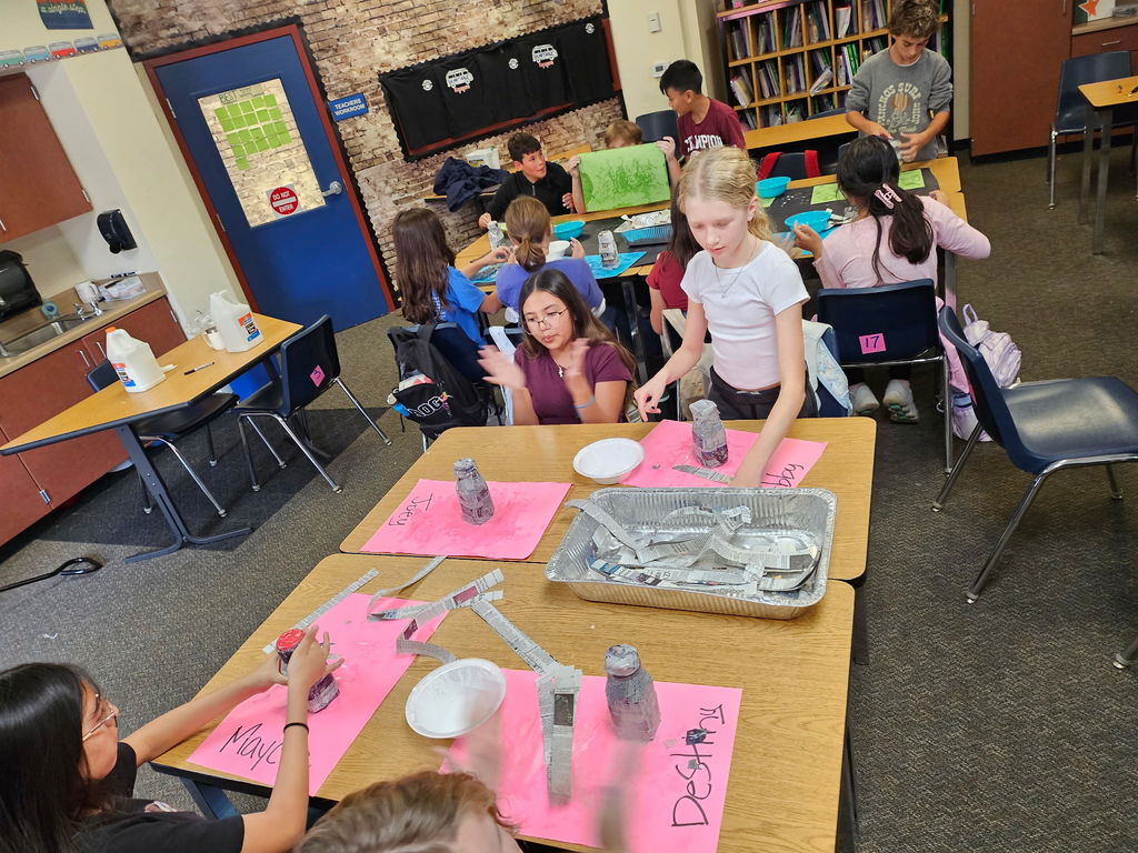 students working in groups in a classroom
