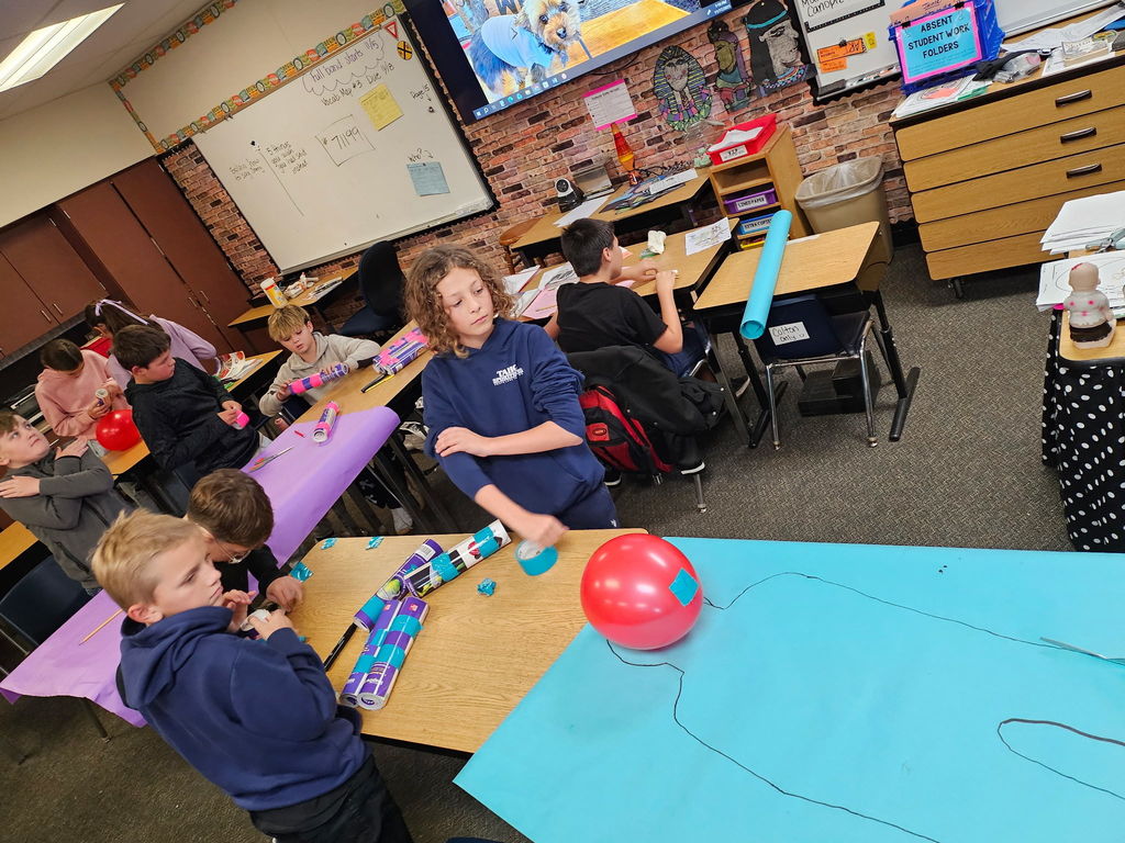 students working in groups in a classroom