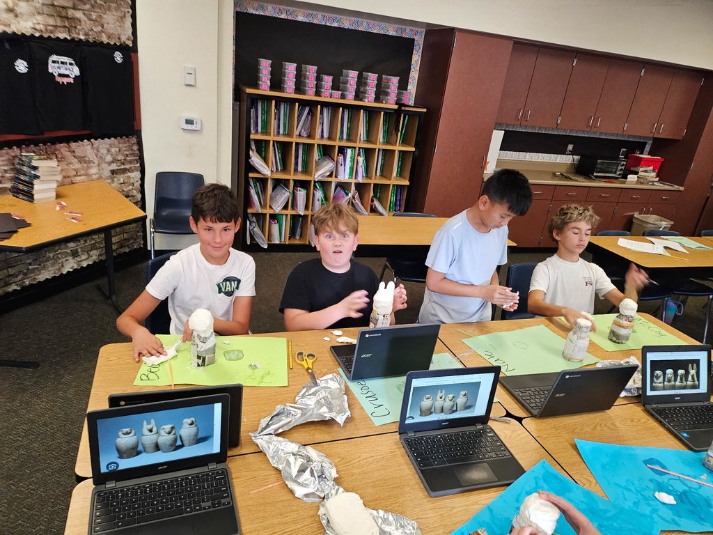 students working in groups in a classroom