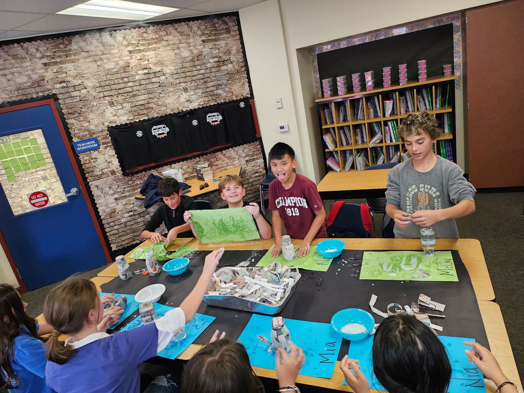 students working in groups in a classroom